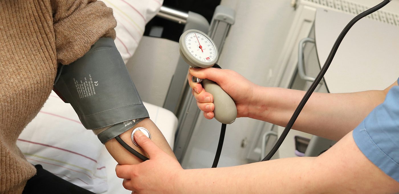 Blood pressure being checked with an arm cuff